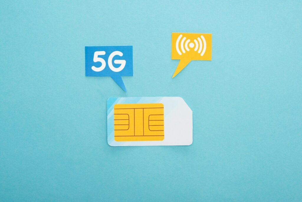 top view of sim card and speech bubbles with 5g lettering on blue background